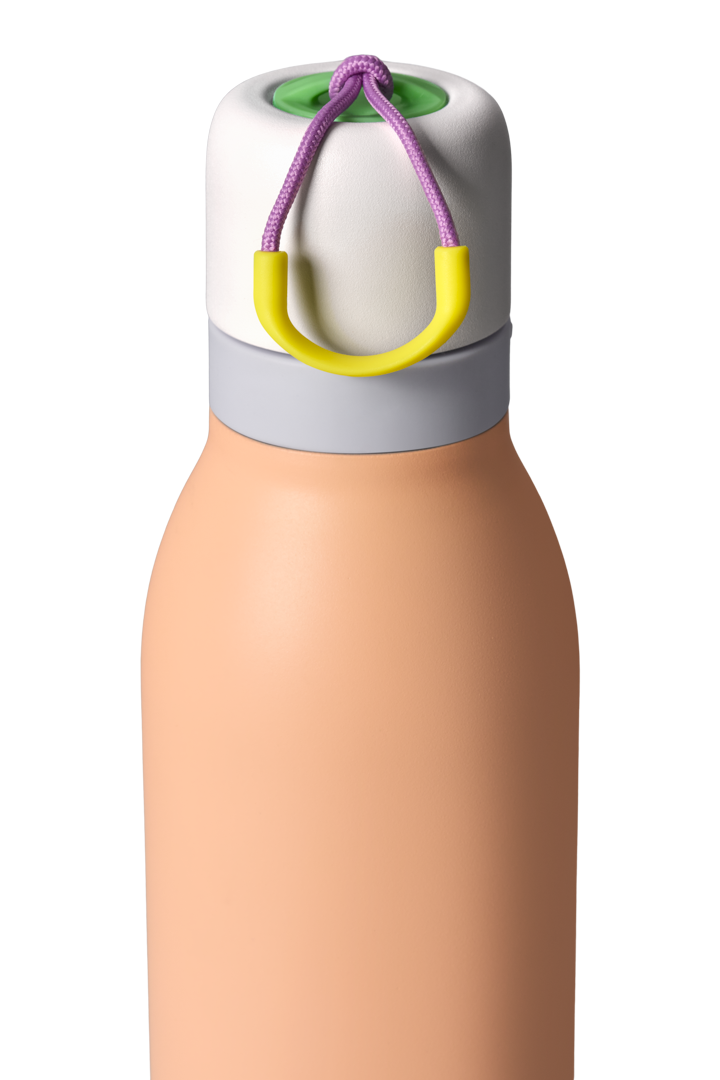 Owala FreeSip Twist 24oz in Peachy Keen, close-up of lid area with twist cap removed showing mauve FreeSip spout, peach body and gray accent band